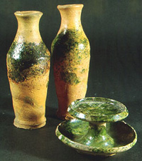Wheel-thrown biconical bottles and a saucer lamp