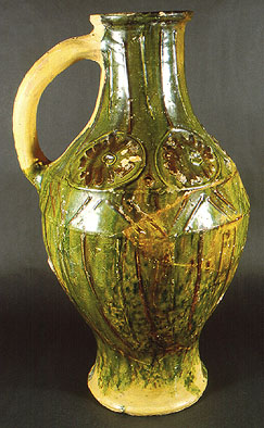 The stimulus of this decorative jug may be derived from life in the forest where the potters gathered their fuel